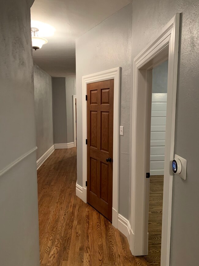 Hallway leading from the living room to the bedrooms, bathroom, and kitchen - 4040 Russell Blvd