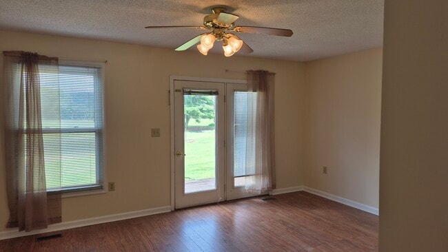 doors to back deck living room - 300 Green Dr