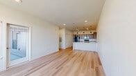 Located at 431 Picadilly Road in Aurora, CO, this one-bedroom, one-bathroom unit offers a well-designed single-floor layout that maximizes its living area through an open-concept floor plan. Light wood-style flooring runs consistently throughout, lending warmth and cohesion to every room.

The combined living, dining, and kitchen area serves as the heart of the home. The kitchen is outfitted with medium-toned wood cabinetry, granite countertops, black stainless steel appliances — including a refrigerator, range, and microwave — and a peninsula with a built-in sink, providing additional prep and seating space. Pendant lighting above the peninsula adds a modern touch, complementing the recessed ceiling lights throughout.

The living area is bright and open, benefiting from large windows that frame outdoor views of the surrounding Colorado landscape. A ceiling fan in the bedroom enhances comfort, while natural light pours in through windows fitted with blinds. The bedroom also features access to a private balcony and a dedicated walk-in closet with built-in shelving.

Two sets of louvered bifold closet doors near the kitchen provide generous additional storage. The bathroom includes a granite-topped vanity with a wood-tone cabinet, a large mirror, and matching flooring. A utility room and an additional closet round out the practical storage options throughout this efficiently planned home.