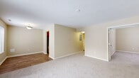 Located at 3855 Oak Lake Cir S in Indianapolis, Indiana, this single-floor, three-bedroom, one-bathroom home offers a practical and comfortable layout. The living room is generously proportioned, featuring soft wall-to-wall carpeting, warm neutral-toned walls, and a sliding glass door with vertical blinds that invite natural light and provide outdoor access. The open sightlines between the living and dining areas create a cohesive, functional flow throughout the main living space.

The kitchen is equipped with warm honey-toned cabinetry offering abundant storage, complemented by light granite-style countertops, a double sink, and wood-look vinyl flooring. Stainless steel appliances complete this functional cooking space.

The primary bedroom is notably spacious, featuring dual reach-in closets with built-in shelving and rod systems, providing exceptional storage. Additional bedrooms are carpeted, well-lit with natural light from large windows with blinds, and offer comfortable living space.

The full bathroom is finished with wood-look vinyl flooring, a warm-toned vanity with a granite-style countertop, a single sink, and a tub-shower combination. Neutral beige tones and clean white trim are consistent throughout the home, creating a cohesive, move-in-ready aesthetic.