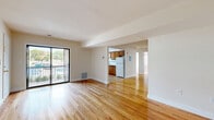 Located at 1205 Sunnyview Oval in Fords, NJ, this well-appointed two-bedroom, two-bathroom residence offers a thoughtfully designed single-floor layout with a warm, clean aesthetic throughout. Polished hardwood floors flow continuously across the living, dining, and bedroom areas, lending a cohesive and inviting character to the entire space.

The open-concept living and dining area is generously proportioned, filled with natural light, and features sliding glass doors that lead to a private balcony with outdoor views. The layout connects seamlessly to the kitchen, which is equipped with warm wood cabinetry, white appliances including a refrigerator, dishwasher, and gas range, as well as a window that brings in additional natural light.

The spacious primary bedroom offers direct access to one of the two bathrooms, which features a tiled tub-shower combo with glass enclosure, a wood vanity, and wood-look tile flooring. The second bedroom is bright and comfortable, highlighted by a large window overlooking greenery. The second bathroom is efficiently designed with subway-style wall tile, a mosaic accent border, a white vanity with medicine cabinet mirror, and wood-look tile flooring.

Additional features include four closets for generous storage, a hallway, and a utility room, rounding out a complete and functional floor plan.