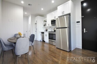 Building Photo - Stunning Brand New 2 BED with W/D in unit!