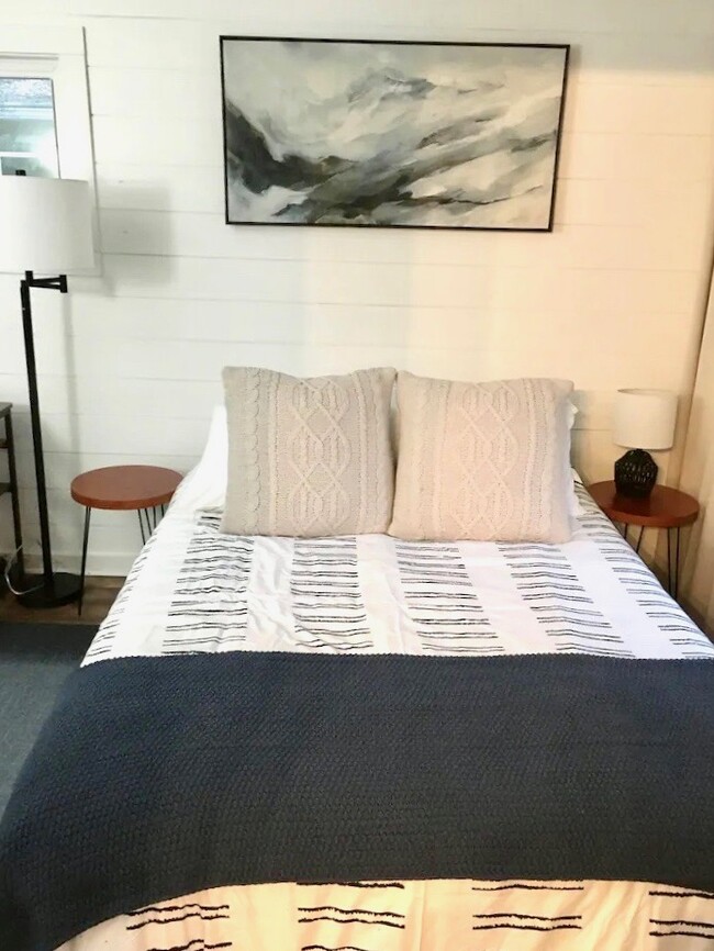 View of the bedroom with a new queen bed - 510 Auburndale Ave
