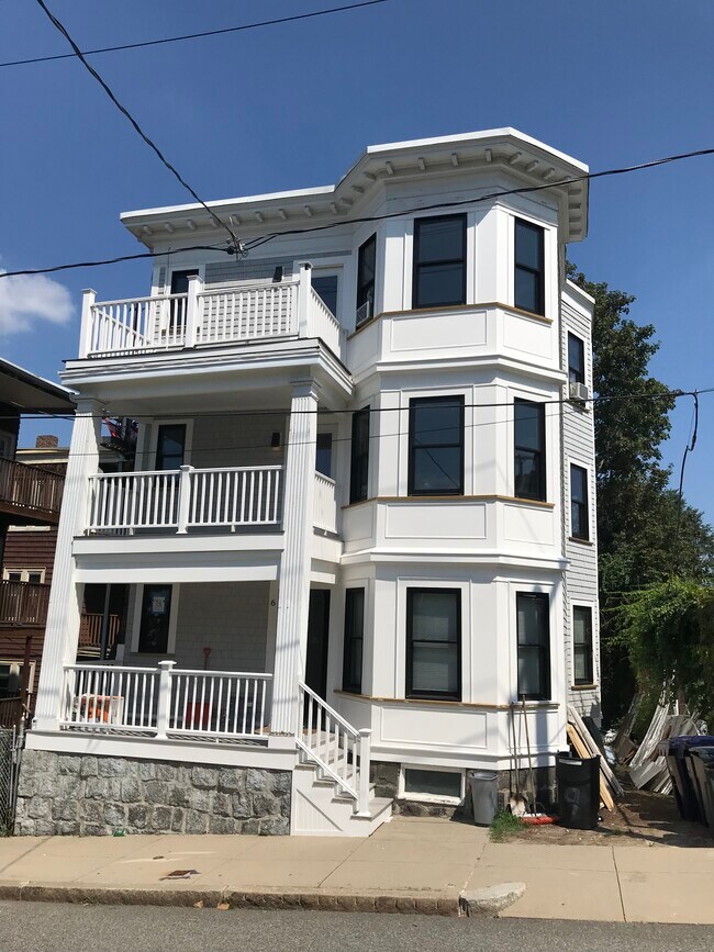 Recent exterior renovation with new siding and black windows - 6 Queen St