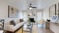 This thoughtfully designed one-bedroom, one-bathroom residence at 6000 Oakmont Trail in Fort Worth, Texas, offers a cohesive blend of modern style and comfortable living. The open-concept layout seamlessly connects the living room, dining area, and kitchen, making efficient use of the space throughout.

The living room is a bright, welcoming retreat centered around a classic fireplace with a decorative mantel. A ceiling fan with integrated lighting, a textured ceiling, and multiple windows that invite natural light complete the room. Distinctive herringbone-pattern flooring runs throughout, adding visual depth and elegance.

The galley-style kitchen is well-appointed with gray cabinetry featuring matte black hardware, white quartz countertops, a tile backsplash, and stainless steel appliances. The adjacent dining area accommodates an intimate table setting beneath a circular pendant light, with a window providing a bright, airy atmosphere.

The primary bedroom is a calm, stylish haven anchored by a bold dark accent wall that contrasts beautifully with the light flooring and crisp white bedding. A hallway connects it conveniently to the rest of the residence.

The bathroom is clean and functional, featuring gray vanity cabinetry with stone-look countertops, black hardware accents, and a full tub-shower combination with white tile surround.