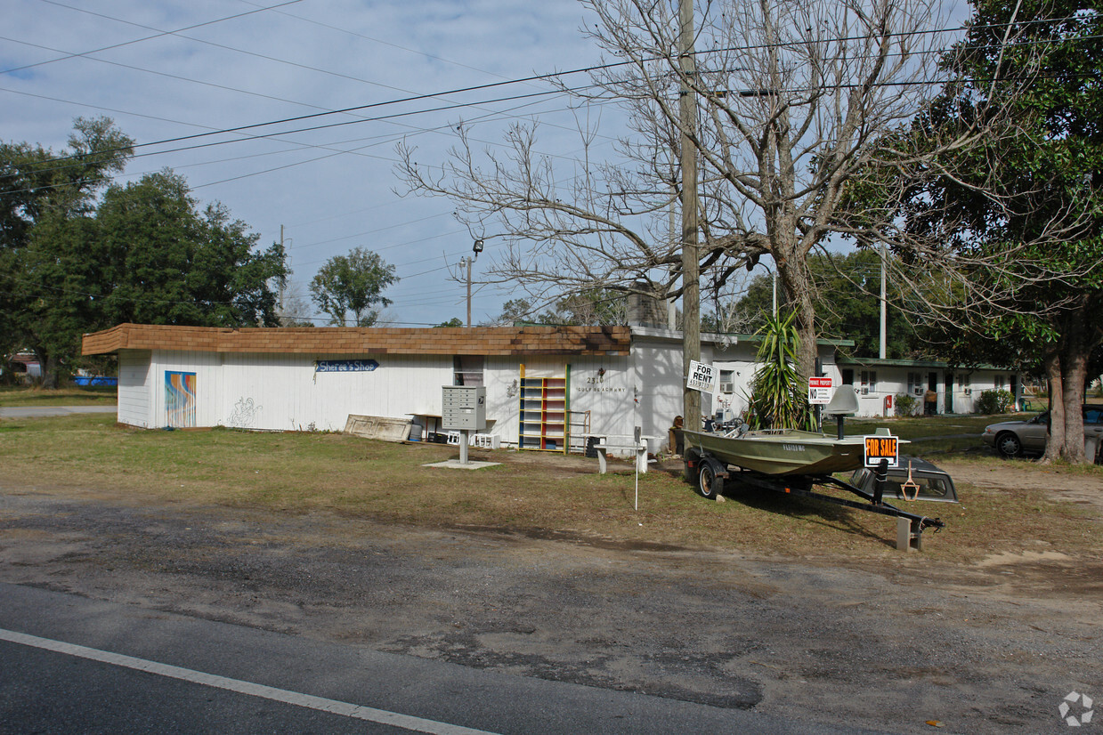 This angle showed the most of the bldg and had unavoidable obstructions. - 2310 Gulf Beach Hwy