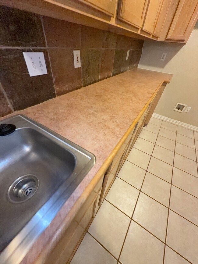 Building Photo - 3/2/2 features an open and inviting living and dining area, updated wood-look flooring, and a spa...
