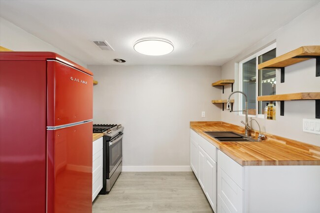 Brand new retro refrigerator with custom cut countertops and shelves. - 327 N 16th Ave