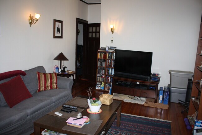 There are high ceilings throughout as seen in this living room picture - 334 Thrall St