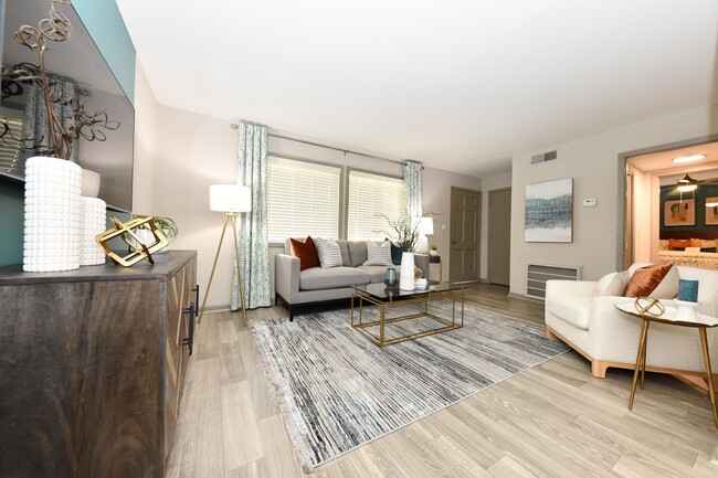 Spacious living room with hardwood-style flooring - Kinley at the Park