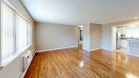 Located at 41 Marshall Rd in Rocky Hill, CT, this 2-bedroom, 1-bathroom unit offers a well-organized single-floor layout designed for comfortable everyday living. The living room is a bright, open space featuring gleaming hardwood floors, a textured ceiling, baseboard heating, and a large window with vertical blinds that allows natural light to fill the room. The layout flows directly into the kitchen, which is outfitted with white shaker-style cabinetry, granite-look countertops, and a full suite of stainless steel appliances including a refrigerator, electric range, and dishwasher. Tile flooring and a window above the sink add functionality and brightness to the space. Both bedrooms are carpeted and finished in neutral tones, each featuring multiple windows that bring in natural light and views of the surrounding greenery, along with baseboard heating. The primary bedroom offers a generous footprint, providing ample room for furnishings. The full bathroom is cleanly appointed with a tub/shower combination, a white vanity with storage, wood-look tile flooring, and a window for natural ventilation. Neutral wall colors and consistent finishes throughout create a cohesive and move-in-ready atmosphere.