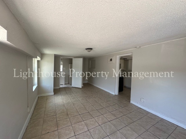 Building Photo - Bright 4 Bedroom Home With Tile Flooring Throughout