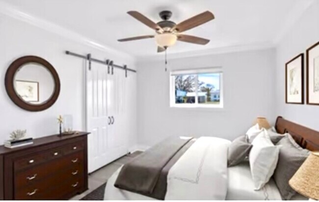 Barn doors, crown, baseboards, ceiling fans. - 2047 Gay Dr