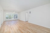 Located on Sunset Boulevard in the desirable Brentwood neighborhood of Los Angeles, this well-appointed one-bedroom, one-bathroom unit offers a thoughtfully designed layout with a clean, modern aesthetic throughout. Light wood flooring flows seamlessly across every room, creating a warm and cohesive feel.

The spacious living room is flooded with natural light through large windows dressed with vertical blinds, and is equipped with a ceiling fan for added comfort. Crisp white walls and an open feel make this an inviting space for everyday living.

The galley-style kitchen is a standout feature, showcasing white shaker cabinetry, quartz countertops, stainless steel appliances including a gas range, microwave, and dishwasher, along with a window that brings in additional natural light.

The bedroom is generously sized and features a wall of mirrored sliding closet doors with built-in upper cabinetry, a ceiling fan, and a large sliding glass door with views of lush greenery, offering a serene, private atmosphere.

The bathroom is well-finished with a white vanity, quartz countertop, brushed nickel fixtures, and a tub-shower combination enclosed by frosted glass sliding doors. A hallway connects the living areas efficiently, completing the functional floor plan.