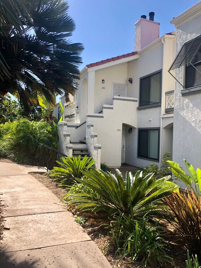 Walking up to the unit from street - 9380 Twin Trails Dr