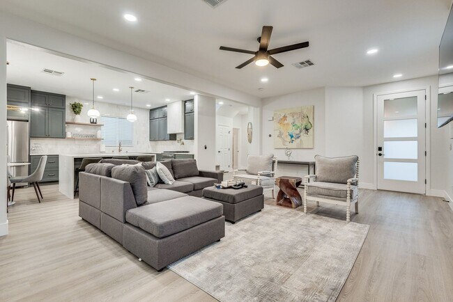Building Photo - FULLY FURNISHED! Exudes sophistication wit...
