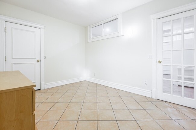 Building Photo - Bright, Beatutiful & Look Out Basement Apt.