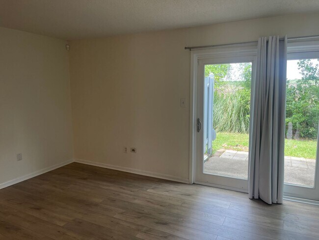 Building Photo - Available now. Beautiful 2 BR/1.5 BA Condo with Marsh View! BOAT RAMP AND BOAT PARKING! WATER/SEW...