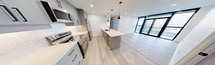 This sleek apartment at 100 Fullarton Street in London, Ontario offers 730 square feet of efficiently designed living space. The open-concept layout maximizes the sense of spaciousness, with the kitchen, living, and dining areas seamlessly integrated. Floor-to-ceiling windows flood the rooms with natural light and provide stunning urban views.

The kitchen boasts modern appliances, including a built-in microwave and stainless steel refrigerator. Light-colored cabinetry and countertops create a bright, clean aesthetic. The primary bedroom, measuring 130 square feet, offers ample space and storage.

Both bathrooms feature contemporary fixtures, with one showcasing a bathtub-shower combination and the other a spacious walk-in shower. The light wood-look flooring throughout adds warmth and continuity to the space.

Recessed lighting and pendant fixtures provide layered illumination, while the neutral color palette creates a versatile backdrop for personal styling. This apartment combines style and functionality, offering a turnkey urban living experience in the heart of London.