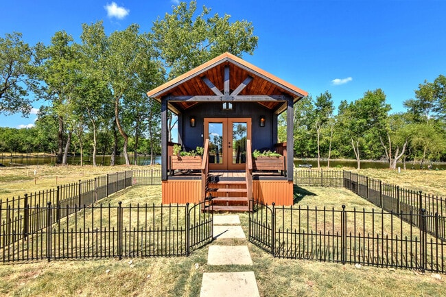 Fenced yard and front deck with planters - 2510 Private Road 1180