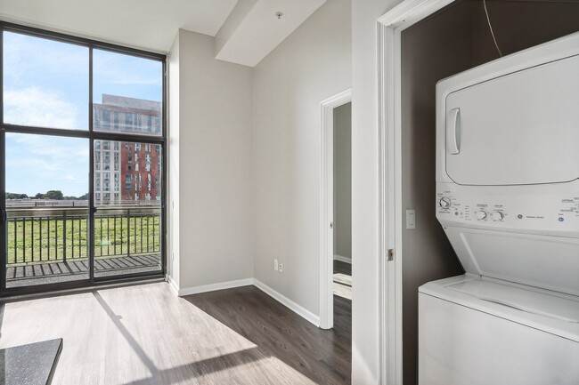 washer and dryer next to a window - Arrive Wheaton