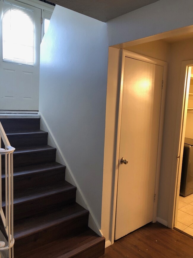 Downstairs landing, looking up at split entry - 7104 S Terrell Cir
