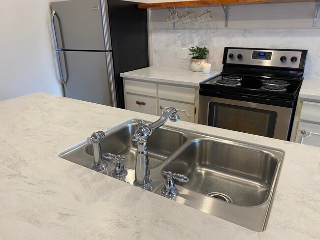 Stainless steel kitchen appliances (dishwasher not pictured). - 685 Lafayette Ave
