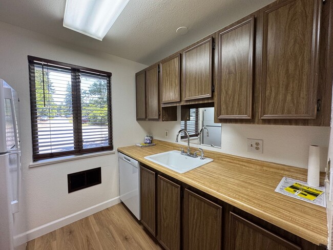 Building Photo - Charming Condo with Creek Views, Laminate ...