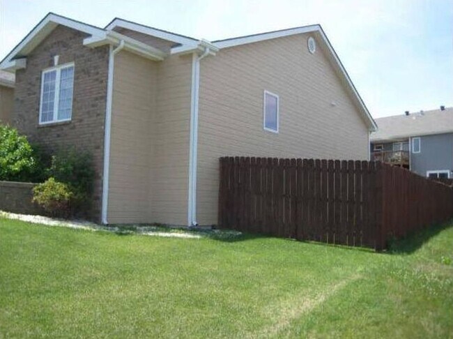 Building Photo - CLOSE TO FORT RILEY! FENCED BACKYARD!