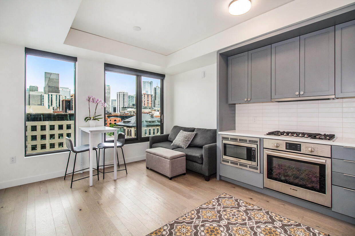Beautiful living area and kitchen. Eat dinner while enjoying views of Union Station and downtown! - 1750 Wewatta St