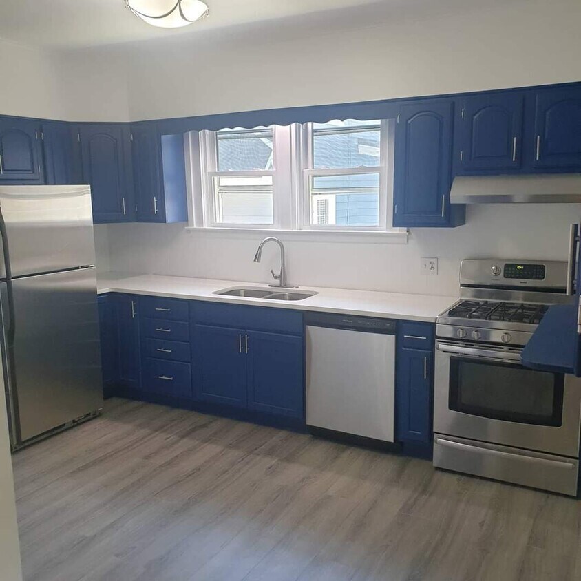 Kitchen stainless steel appliances with quartz countertops - 115 7th Ave