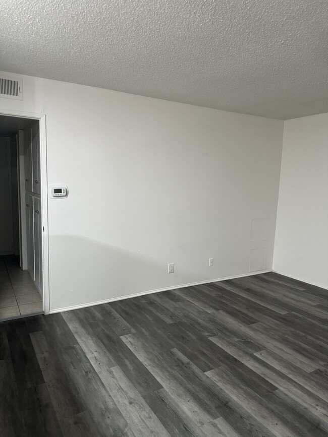 Living room with LVP flooring - 3455 Elm Ave