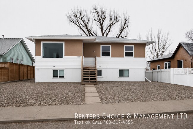 Photo du bâtiment - Pet Friendly Suite with Driveway Parking & Private Laundry