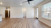 Located at 1200 Duff Drive in Fort Collins, CO, this well-appointed 3-bedroom, 2-bathroom unit offers a thoughtfully designed single-floor layout with contemporary finishes throughout. The open-concept kitchen and living area serves as the heart of the home, featuring light wood cabinetry, stainless steel appliances, a white subway tile backsplash, and a large granite-topped island with an undermount sink — ideal for both cooking and entertaining. Wood-look plank flooring flows seamlessly throughout the entire unit, adding warmth and visual continuity.

The spacious living room is bright and airy, equipped with a ceiling fan and recessed lighting, with access to a private balcony that overlooks a landscaped courtyard and the surrounding community. Each bedroom offers natural light through large windows with blinds, and the primary bedroom includes a double-door closet and an en-suite bathroom. Both bathrooms are finished with granite countertops, wood-toned vanities, large mirrors, and wood-look flooring. The primary bath also features a walk-in closet with built-in shelving. Two hallways connect the rooms efficiently, while grey Shaker-style interior doors add a clean, modern aesthetic throughout the unit.
