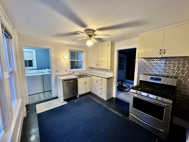 kitchen with dishwasher and propane stove - 20 Pinewood Cir