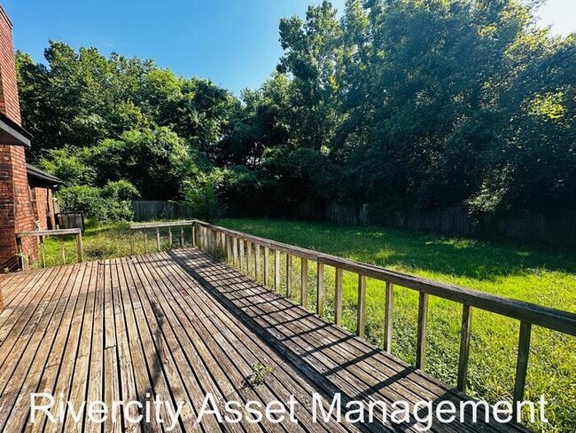 Building Photo - charming three-bedroom, two-full-bath resi...