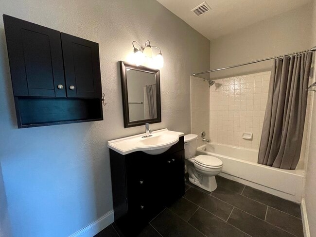 Recently tiled guest bathroom - 12166 Metric Blvd (Austin, TX) Apartment