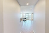 Located at 3578 Rambla Pl in Santa Clara, California, this modern 2-bedroom, 3-bathroom residence offers a well-designed single-floor layout with a clean, contemporary aesthetic. Light wood flooring flows consistently throughout all living areas, complementing the neutral, warm-toned walls and crisp white trim.

The open-concept living room and kitchen area serves as the heart of the home. The kitchen is appointed with flat-front wood-grain cabinetry, white quartz countertops, stainless steel appliances including a refrigerator with ice maker, gas range, microwave, and dishwasher, along with a tile backsplash. A central island provides additional prep and dining space.

The living area opens to expansive corner windows that frame urban views of the surrounding Santa Clara cityscape, flooding the space with natural light. A sliding glass door leads to a balcony, further enhancing the connection to the outdoors.

The primary bedroom features large corner windows with scenic views and a dedicated closet. The secondary bedroom also benefits from generous window placement and includes a built-in sliding-door closet. All three bathrooms maintain the home's clean design language, with one featuring a full soaking tub and shower combination with a grab bar and wood-toned vanity cabinetry. A hallway connects all rooms efficiently, completing this thoughtfully designed residence.
