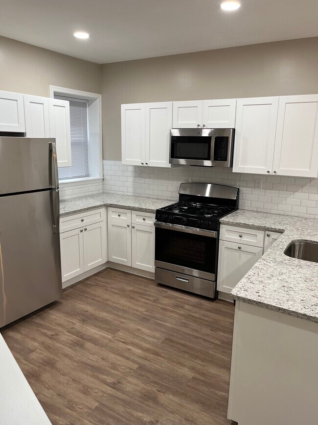 Kitchen with new appliances - 5311 Ogden St
