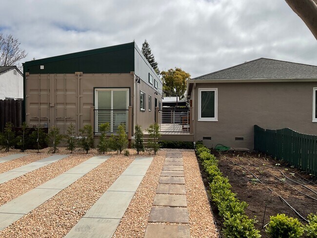 Available unit is the container home ADU on the left - 1490 Ash St
