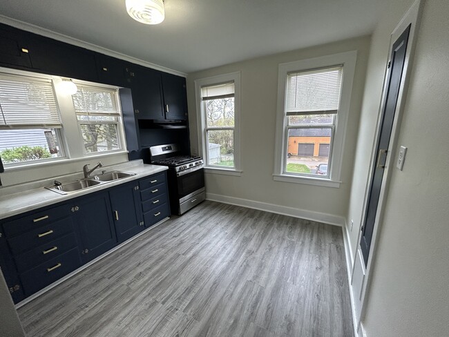 New kitchen flooring with freshly painted cabinets - 508 Jersey Ave