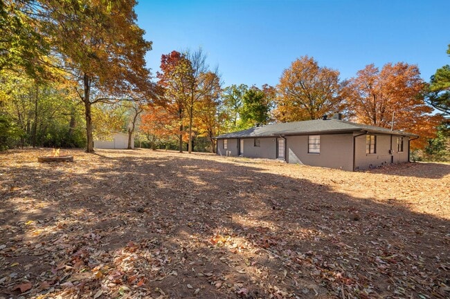 Building Photo - Updated Home with Spacious, Tree-Lined Yar...
