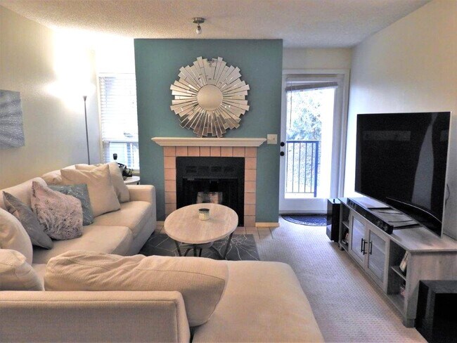 Living room with wood burning firaplace - 13717 Linden Ave N