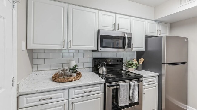 Revel in our kitchens featuring top-of-the-line stainless-steel appliances. Embrace the pristine appeal and culinary excellence in your new home. - River Bluff of Lexington