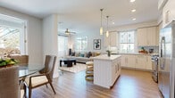 Located at 13385 Highlands Pl in the desirable Carmel Valley neighborhood of San Diego, CA, this single-story residence offers a thoughtfully designed open-concept layout filled with natural light. Wide-plank wood-style flooring flows seamlessly through the main living areas, creating a cohesive and contemporary aesthetic.

The kitchen is a standout feature, showcasing light cabinetry, a striking quartz waterfall island with bar seating, a decorative arabesque tile backsplash, and a full suite of stainless steel appliances. Pendant lighting adds warmth and visual interest overhead. The kitchen opens directly to the living room, which benefits from multiple windows, a ceiling fan, and an inviting, airy atmosphere.

A dedicated dining area sits adjacent to the living space, offering access to an outdoor area through a sliding glass door. The bedrooms are carpeted for comfort, with generous closet space including walk-in storage. The primary bathroom features a glass-enclosed walk-in shower finished with large-format neutral stone-look tile and sleek brushed nickel fixtures.

Throughout the residence, recessed lighting, crisp white walls, and an abundance of natural light from multiple windows contribute to a bright, modern ambiance well-suited to the sunny San Diego lifestyle.