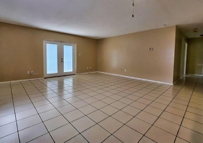 Building Photo - Charming 3-Bedroom Home with Pool, 2-Car Garage, and Tile Flooring Throughout!