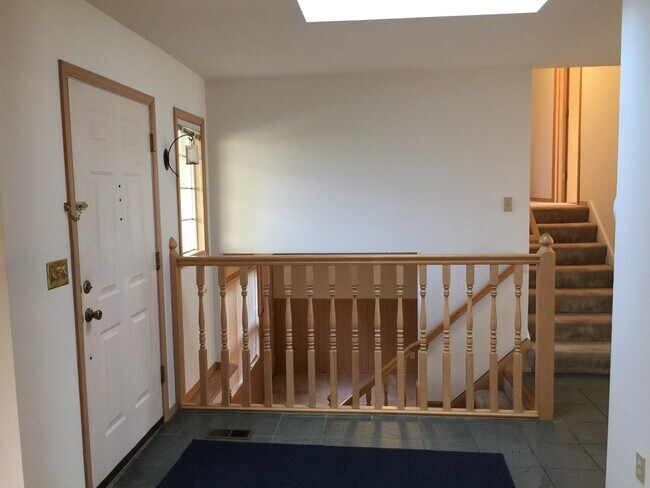 View from front door into upstairs bedroom level and lower level sitting room - 5433 SW Dover Ct