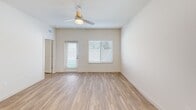 Located at 9000 Little Palm Way in Venice, FL, this single-story, one-bedroom, one-bathroom home offers a clean, modern design with an efficient and well-organized layout. Light-toned luxury vinyl plank flooring runs throughout, complementing the neutral wall palette and creating a bright, cohesive aesthetic.

The open-concept living and dining area is filled with natural light from multiple windows dressed with white blinds, and a ceiling fan adds comfort to the airy space. The kitchen is a standout feature, outfitted with crisp white shaker cabinetry, white quartz countertops, a subway tile backsplash in soft gray, and a full suite of stainless steel appliances including a French door refrigerator, electric range, microwave, and dishwasher. A central island provides additional prep and dining space, while pendant lighting adds a polished touch.

The spacious bedroom includes ample natural light, a ceiling fan, and access to two closets. The bathroom features a white vanity with brushed nickel hardware and a glass-enclosed walk-in shower. A dedicated laundry room with a full-size washer and dryer adds everyday convenience. The private patio with a grassy area rounds out this well-appointed home.