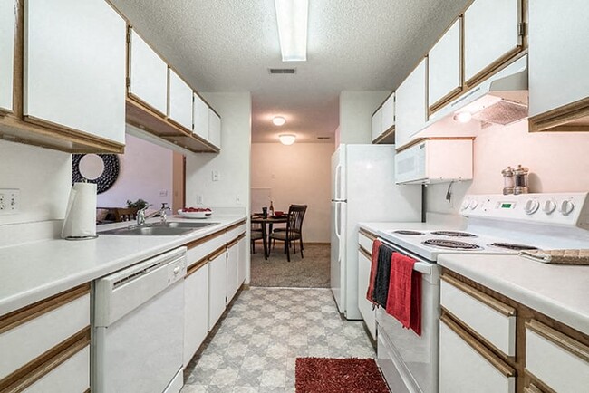 Bright kitchen with lots of cabinet storage space. - Northbrook Apartments