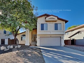 Building Photo - 8445 W Emile Zola Ave